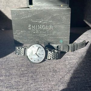 All black Shinola watch with mother of pearl background